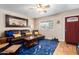 Living room with brown leather sofa and blue rug at 1360 W 15Th St, Tempe, AZ 85281