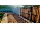 Backyard with wooden gate and gravel area at 1360 W 15Th St, Tempe, AZ 85281