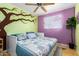 Bedroom with a daybed and a whimsical tree mural at 1360 W 15Th St, Tempe, AZ 85281