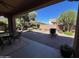 Covered patio with brick pavers and seating area at 120 E Camellia Way, San Tan Valley, AZ 85140