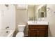 Clean bathroom with a shower/tub combo, vanity, and toilet at 120 E Camellia Way, San Tan Valley, AZ 85140