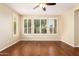 Bright bedroom with hardwood floors and plantation shutters at 120 E Camellia Way, San Tan Valley, AZ 85140