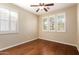 Bedroom with hardwood floors and plantation shutters at 120 E Camellia Way, San Tan Valley, AZ 85140