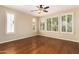 Bright bedroom with hardwood floors and plantation shutters at 120 E Camellia Way, San Tan Valley, AZ 85140