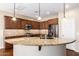 Spacious kitchen with island, granite countertops, and stainless steel appliances at 120 E Camellia Way, San Tan Valley, AZ 85140