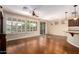 Living room with hardwood floors, sliding glass door and kitchen view at 120 E Camellia Way, San Tan Valley, AZ 85140