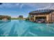 Luxury pool with swim-up bar and pergola at 120 E Camellia Way, San Tan Valley, AZ 85140