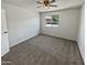 Simple bedroom with grey carpet and ceiling fan at 3511 E Baseline Rd # 1031, Phoenix, AZ 85042