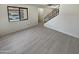 Living room with grey tile floors and staircase to upper level at 3511 E Baseline Rd # 1031, Phoenix, AZ 85042