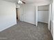 Bedroom with carpet flooring and a large closet at 3511 E Baseline Rd # 1031, Phoenix, AZ 85042