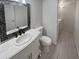 Bathroom with white vanity, mosaic mirror, and grey tile floor at 3511 E Baseline Rd # 1031, Phoenix, AZ 85042