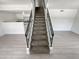 Modern staircase with metal railing leading upstairs at 3511 E Baseline Rd # 1031, Phoenix, AZ 85042