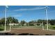 Sand volleyball court with net and surrounding area at 1438 W Coral Reef Dr, Gilbert, AZ 85233