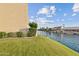 Peaceful view of a canal from a grassy backyard at 1438 W Coral Reef Dr, Gilbert, AZ 85233