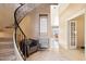 Elegant curved staircase with wrought iron railing at 1438 W Coral Reef Dr, Gilbert, AZ 85233