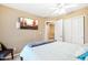 Bedroom with a large TV and en-suite bathroom at 1438 W Coral Reef Dr, Gilbert, AZ 85233
