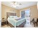 Guest bedroom with private balcony and ceiling fan at 1438 W Coral Reef Dr, Gilbert, AZ 85233