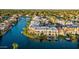 Aerial view showcasing waterfront property with boat docks and canal access at 1438 W Coral Reef Dr, Gilbert, AZ 85233