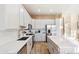 Modern kitchen with white cabinets, stainless steel appliances, and quartz countertops at 1438 W Coral Reef Dr, Gilbert, AZ 85233