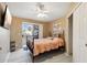 Bright bedroom with patio access and ceiling fan at 1438 W Coral Reef Dr, Gilbert, AZ 85233