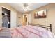 Spacious bedroom with large closet and ceiling fan at 1438 W Coral Reef Dr, Gilbert, AZ 85233