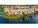 Aerial view of a waterfront property with boat slips and lush landscaping at 1438 W Coral Reef Dr, Gilbert, AZ 85233