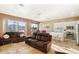 Open living room and kitchen with recessed lighting and tiled floors at 1438 W Coral Reef Dr, Gilbert, AZ 85233