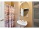 Simple bathroom with pedestal sink and shower/tub combo at 1438 W Coral Reef Dr, Gilbert, AZ 85233