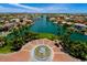 Aerial view of expansive lakefront property with a circular fountain at 1438 W Coral Reef Dr, Gilbert, AZ 85233