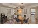 Bright dining area with glass table and view of bedroom at 6649 N Majorca E Ln, Phoenix, AZ 85016