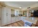 Modern kitchen with white cabinets, quartz countertops and wood flooring at 6649 N Majorca E Ln, Phoenix, AZ 85016