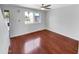 Bright bedroom with wood floors and a ceiling fan at 1750 E Mateo Cir # 103, Mesa, AZ 85204