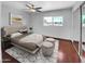 Spacious bedroom featuring a king-size bed and wood floors at 1750 E Mateo Cir # 103, Mesa, AZ 85204