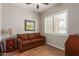 Small office or den with a brown couch and large window at 11225 E Ocaso Ave, Mesa, AZ 85212