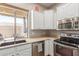 Kitchen corner features granite countertops and stainless steel appliances at 11225 E Ocaso Ave, Mesa, AZ 85212