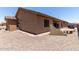 Landscaped backyard with gravel and a patio area at 11225 E Ocaso Ave, Mesa, AZ 85212