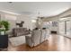 Spacious living room with two sofas and a large TV at 11225 E Ocaso Ave, Mesa, AZ 85212
