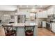 Island kitchen features stainless steel appliances and granite countertops at 11225 E Ocaso Ave, Mesa, AZ 85212