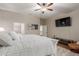 Bedroom with queen-size bed and built-in TV at 11225 E Ocaso Ave, Mesa, AZ 85212