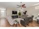 Living room with comfortable seating and large TV at 11225 E Ocaso Ave, Mesa, AZ 85212