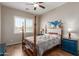Guest bedroom with a queen-size bed and ceiling fan at 11225 E Ocaso Ave, Mesa, AZ 85212