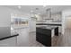 Modern kitchen with island and stainless steel appliances at 632 N 72Nd Pl, Scottsdale, AZ 85257
