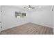 Bright bedroom with wood-look flooring and a ceiling fan at 632 N 72Nd Pl, Scottsdale, AZ 85257