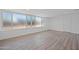 Spacious living room with large windows and wood-look floors at 632 N 72Nd Pl, Scottsdale, AZ 85257
