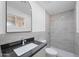 Updated bathroom with gray tile shower and dark vanity at 632 N 72Nd Pl, Scottsdale, AZ 85257