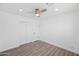 Bright bedroom with wood-look floors and double doors at 632 N 72Nd Pl, Scottsdale, AZ 85257