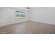 Bright living room with wood-look floors and a window at 632 N 72Nd Pl, Scottsdale, AZ 85257