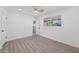 Bright bedroom with wood-look floors and access to a bathroom at 632 N 72Nd Pl, Scottsdale, AZ 85257