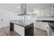 Modern kitchen with island and stainless steel appliances at 632 N 72Nd Pl, Scottsdale, AZ 85257