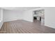 Living area with wood-look floors and open view to kitchen at 632 N 72Nd Pl, Scottsdale, AZ 85257